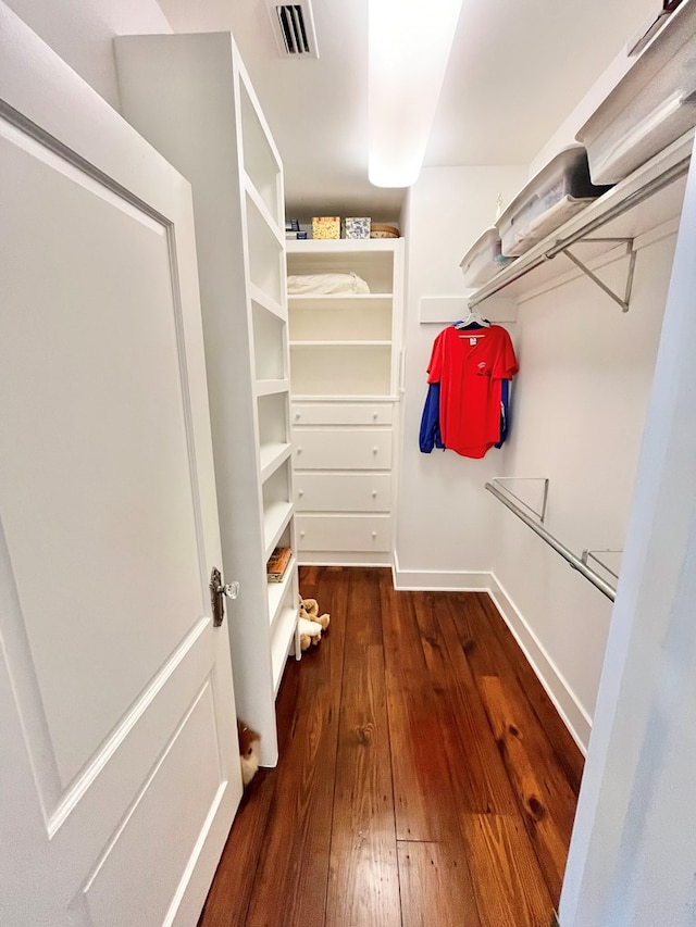 walk in closet with wood-type flooring and visible vents