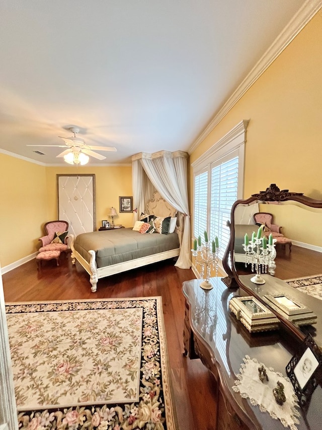 bedroom featuring ornamental molding, wood finished floors, and baseboards