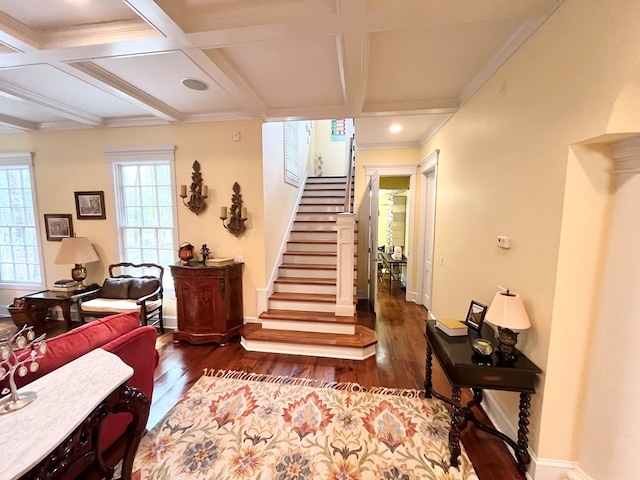 interior space with coffered ceiling, beamed ceiling, baseboards, and wood finished floors