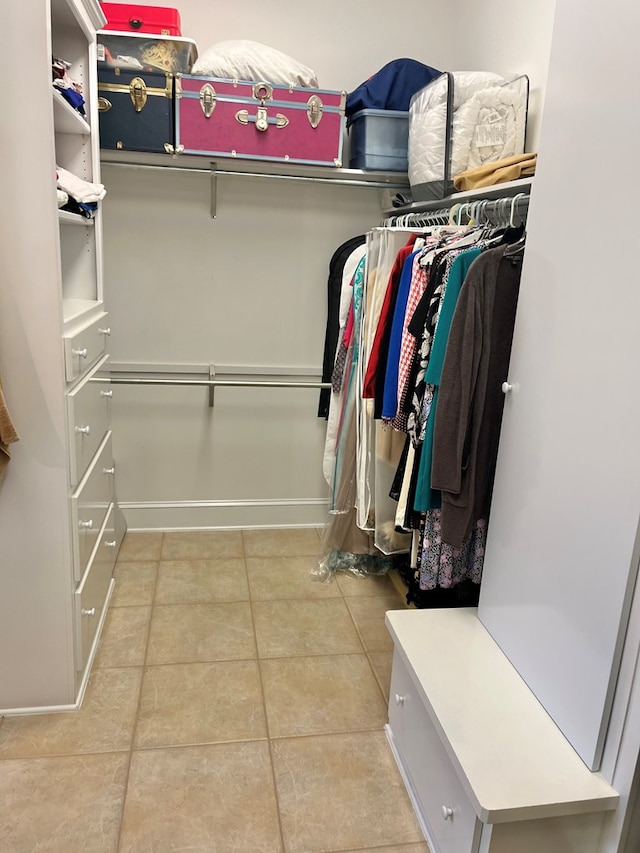 spacious closet featuring tile patterned flooring