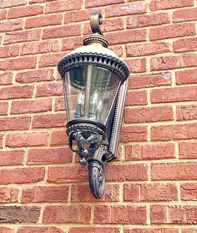 exterior details featuring brick siding