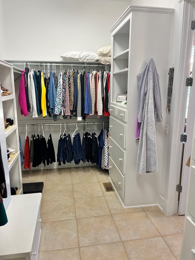 spacious closet with visible vents and tile patterned floors