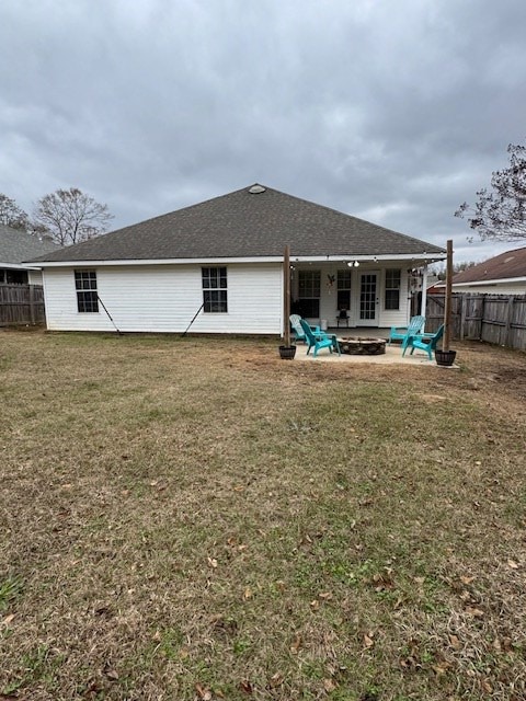 rear view of house featuring a lawn, ceiling fan, and a patio