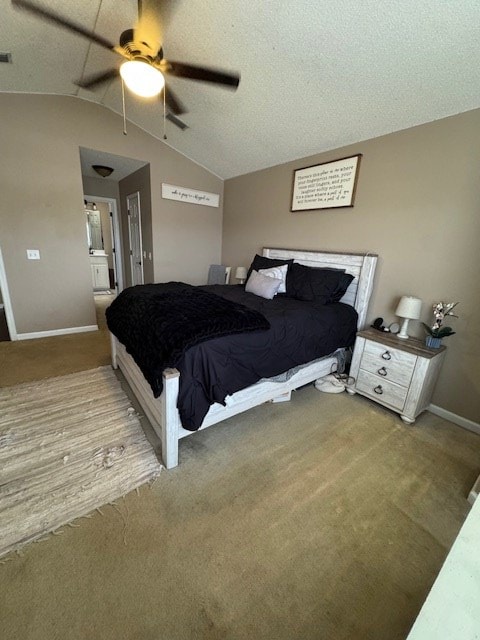 bedroom with carpet flooring, ceiling fan, a textured ceiling, and vaulted ceiling