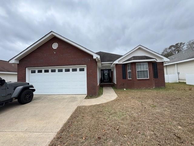 ranch-style home with a garage