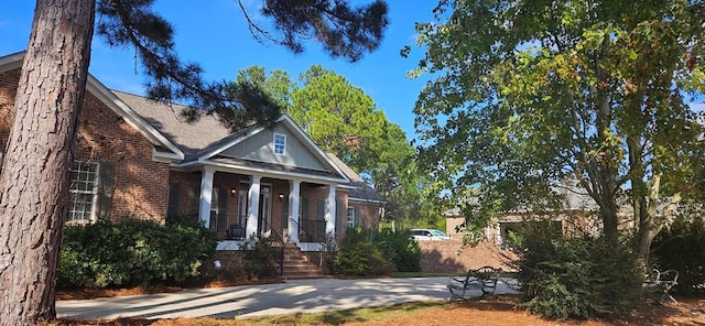 greek revival house featuring brick siding