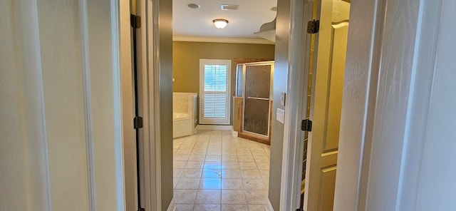 bathroom with tile patterned flooring, visible vents, a shower stall, and crown molding