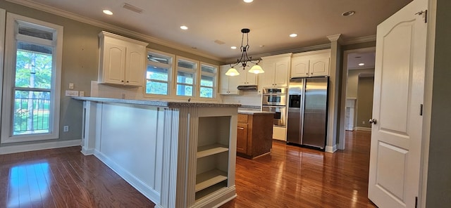 kitchen featuring visible vents, appliances with stainless steel finishes, white cabinetry, and ornamental molding