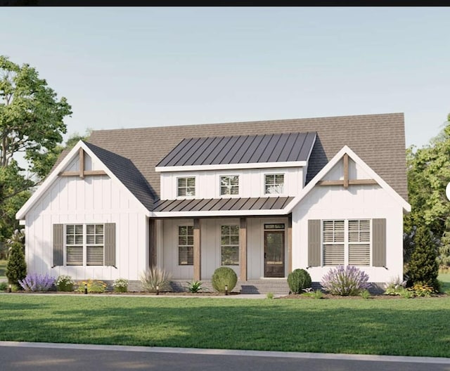 517 Gladstone Way, Dothan, AL 36305 - modern farmhouse featuring board and batten siding, a front yard, a standing seam roof, and a metal roof