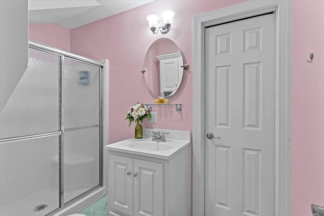 bathroom featuring a shower stall and vanity