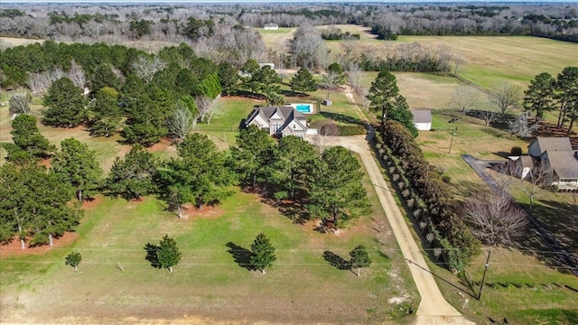 birds eye view of property with a rural view