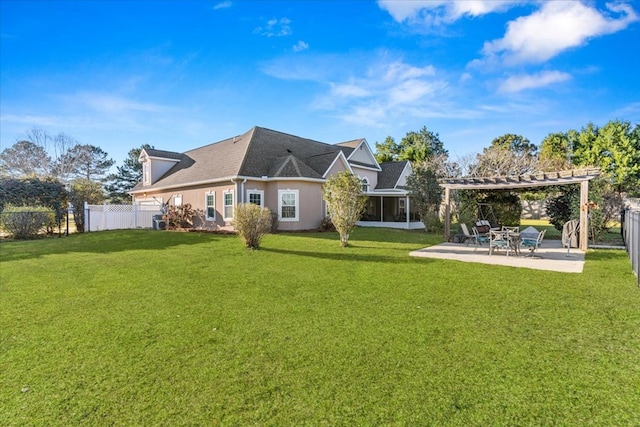 back of house featuring fence, a sunroom, a yard, a pergola, and a patio area