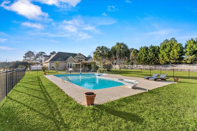 view of pool with a patio, fence, a diving board, a lawn, and a fenced in pool