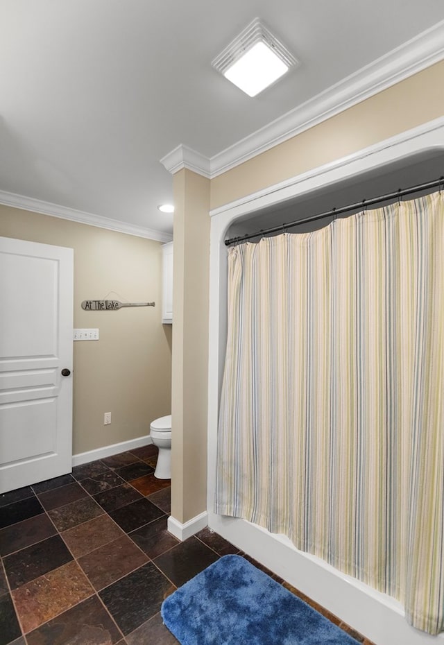 bathroom featuring toilet, crown molding, and shower / tub combo with curtain