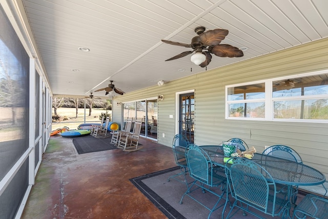 sunroom / solarium with ceiling fan