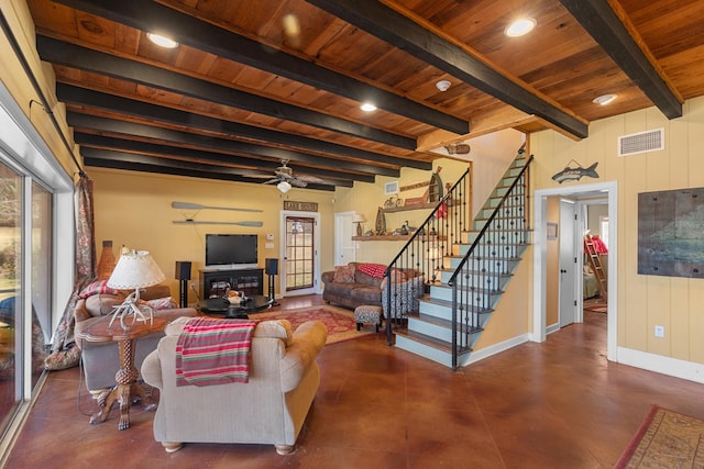 living room featuring beamed ceiling, ceiling fan, and wooden ceiling