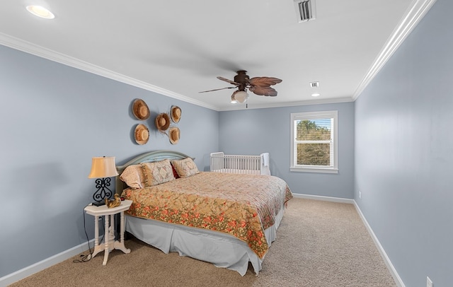 carpeted bedroom with ceiling fan and crown molding