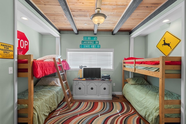 bedroom featuring beamed ceiling and wooden ceiling