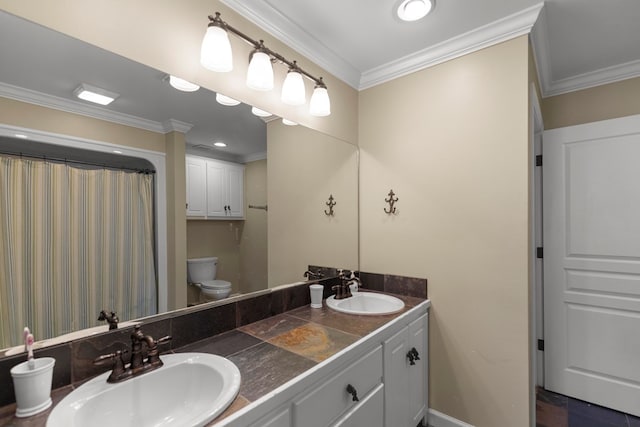 bathroom with vanity, toilet, and crown molding