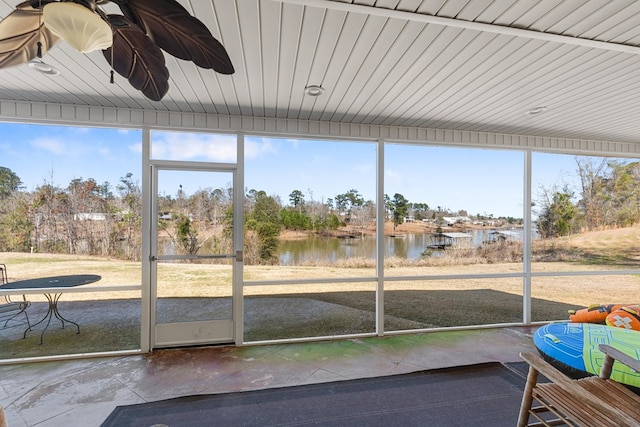 unfurnished sunroom featuring a wealth of natural light and a water view