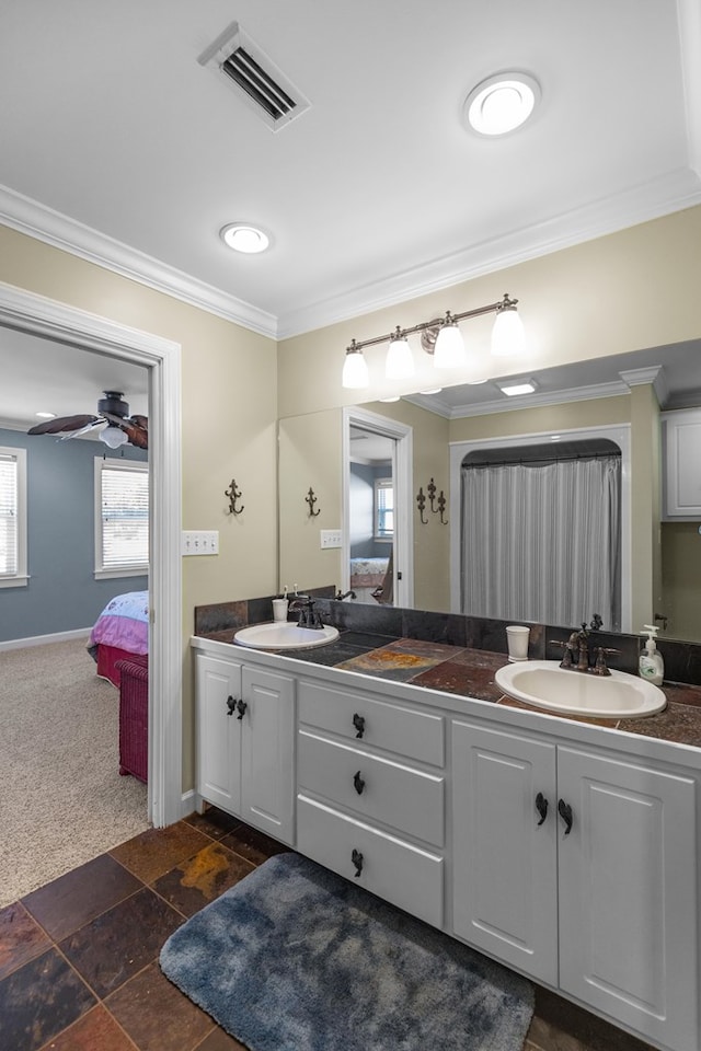 bathroom with crown molding, vanity, and ceiling fan