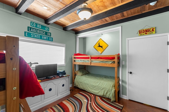 tiled bedroom with beamed ceiling and wood ceiling