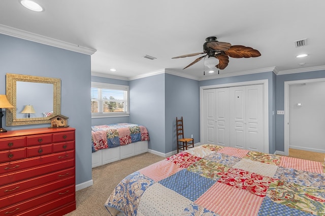 bedroom with ceiling fan, a closet, and crown molding