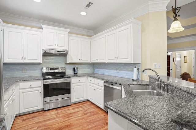 106 Camberly Ct, Dothan, AL 36301 - kitchen with appliances with stainless steel finishes, under cabinet range hood, white cabinets, light wood finished floors, and crown molding