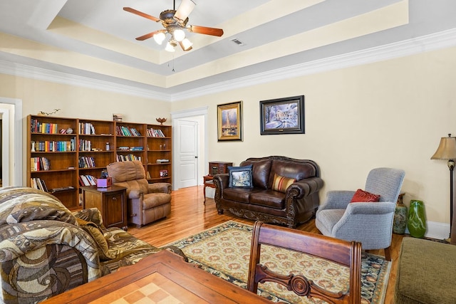 106 Camberly Ct, Dothan, AL 36301 - living area with ceiling fan, wood finished floors, a raised ceiling, and crown molding