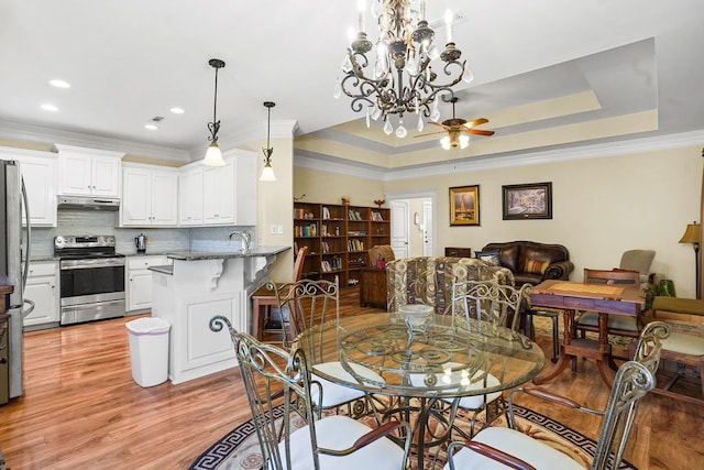 106 Camberly Ct, Dothan, AL 36301 - dining space with light wood-style flooring, crown molding, a chandelier, recessed lighting, and a raised ceiling