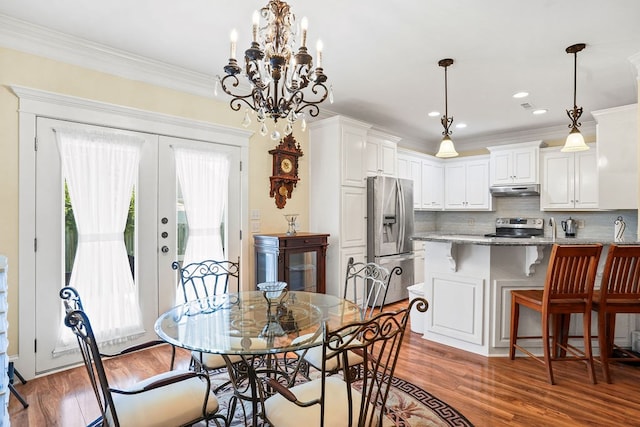 106 Camberly Ct, Dothan, AL 36301 - dining space with wood finished floors, ornamental molding, a chandelier, and recessed lighting