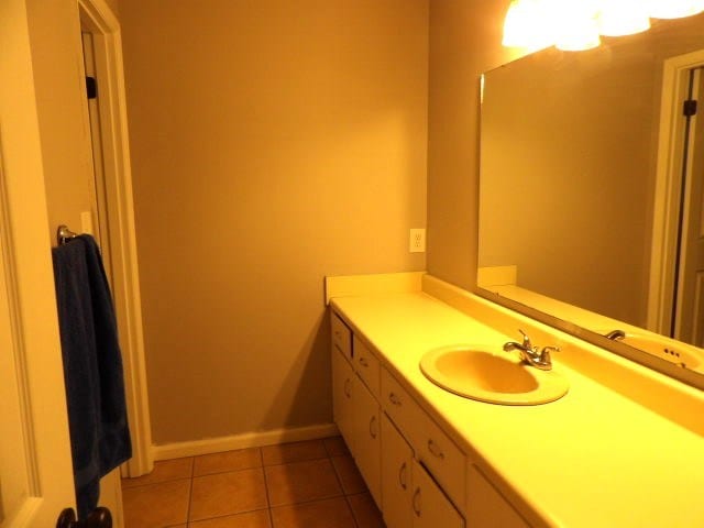 bathroom with vanity and tile patterned flooring