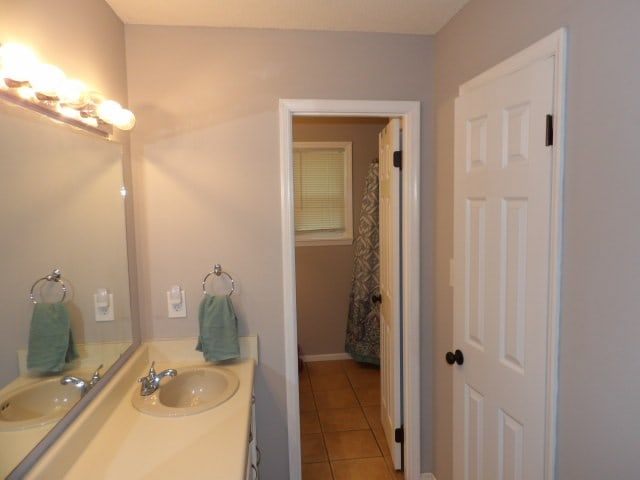 bathroom featuring tile patterned floors and vanity