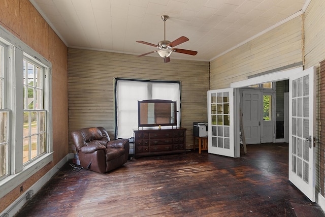 sitting room featuring ornamental molding, plenty of natural light, french doors, and ceiling fan