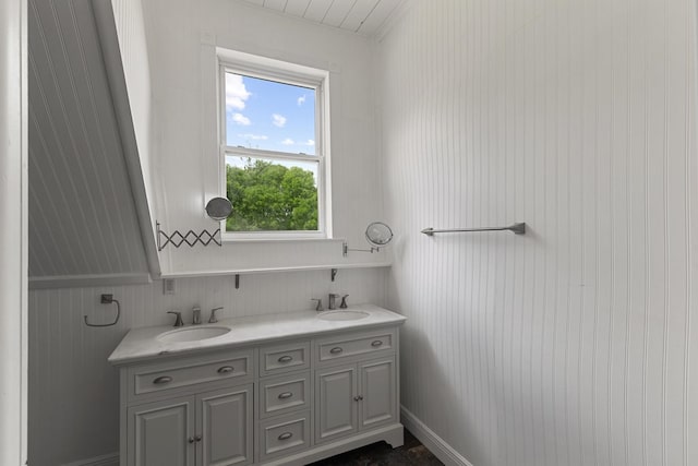 bathroom with plenty of natural light, double vanity, and a sink