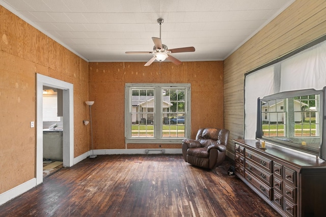 sitting room featuring ornamental molding, a healthy amount of sunlight, ceiling fan, and hardwood / wood-style flooring