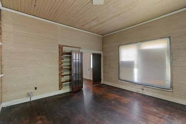 spare room with wooden walls and french doors