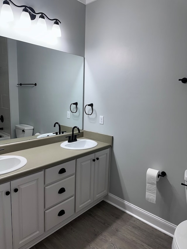 183 Chestnutt Rd, Slocomb, AL 36375 - full bathroom with double vanity, wood finished floors, and a shower