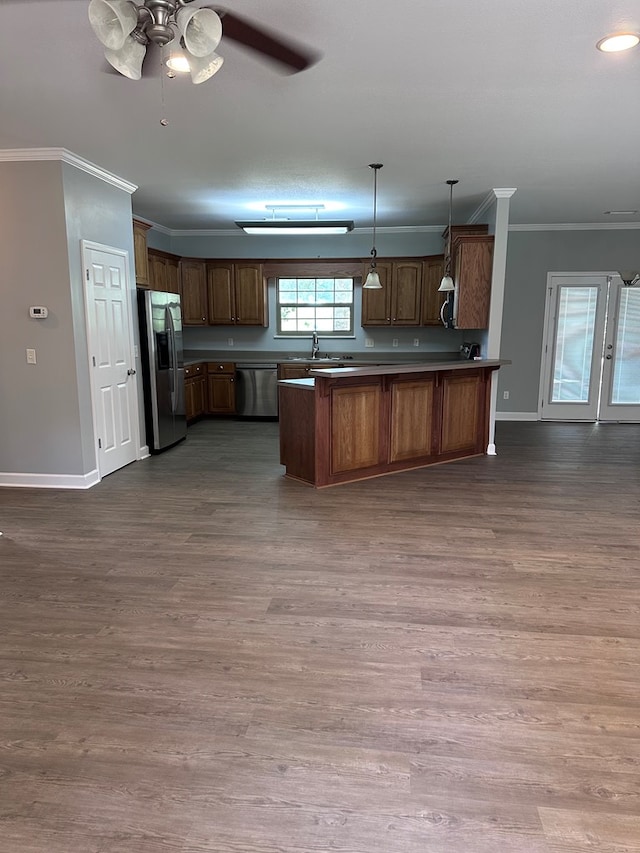 183 Chestnutt Rd, Slocomb, AL 36375 - kitchen featuring appliances with stainless steel finishes, crown molding, a peninsula, ceiling fan, and open floor plan