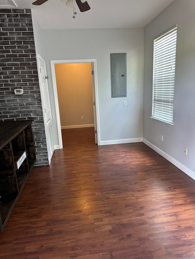 183 Chestnutt Rd, Slocomb, AL 36375 - unfurnished living room with electric panel, a ceiling fan, and dark wood-style flooring