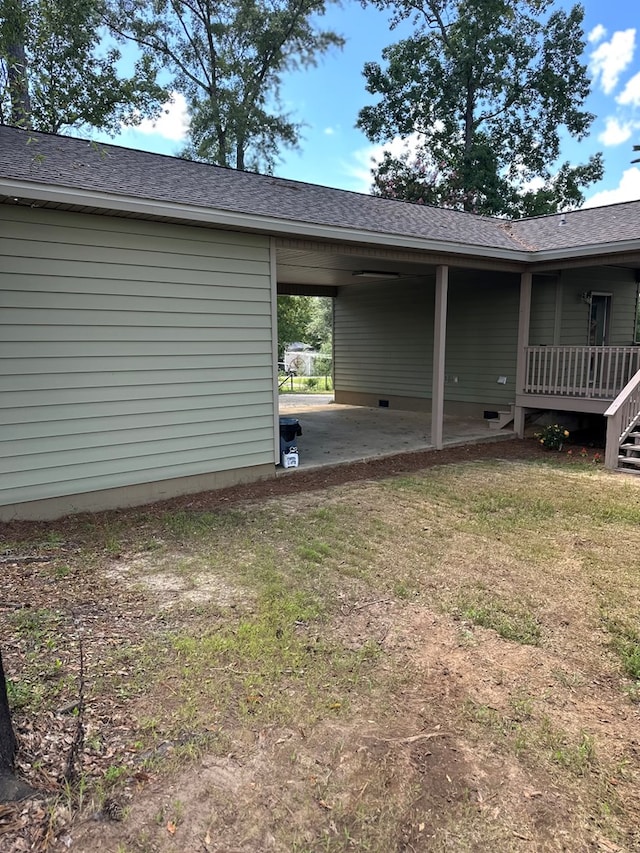 183 Chestnutt Rd, Slocomb, AL 36375 - view of grassy yard featuring a patio and a carport