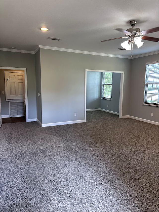 183 Chestnutt Rd, Slocomb, AL 36375 - unfurnished room with ornamental molding, plenty of natural light, dark carpet, and ceiling fan