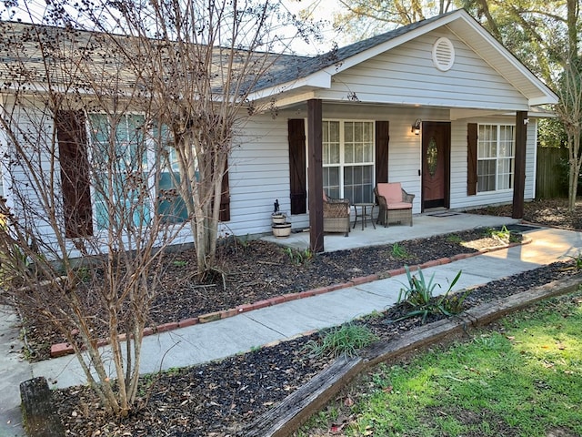 ranch-style home featuring covered porch