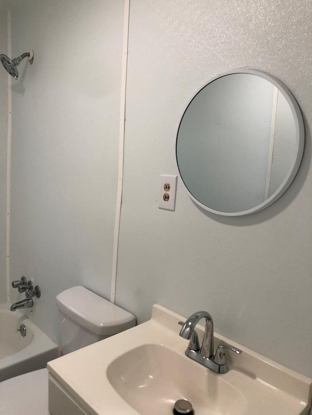 full bathroom featuring vanity, toilet, and tub / shower combination