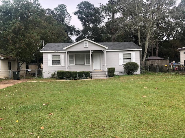 view of front of home with a porch and a front lawn