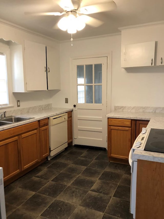 kitchen with white cabinetry, ceiling fan, sink, white appliances, and ornamental molding