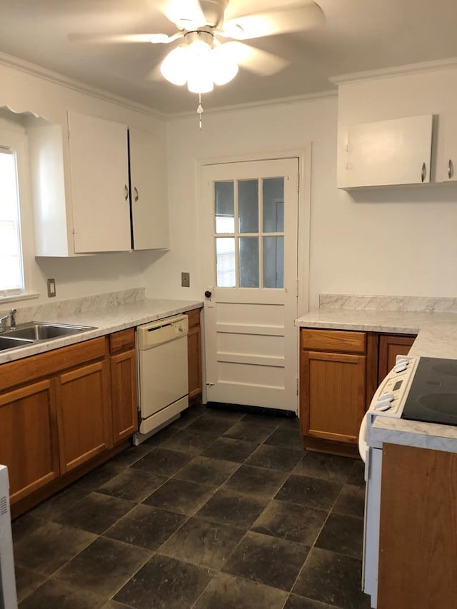 1305 Petty St, Dothan, AL 36301 - kitchen with white appliances, ornamental molding, light countertops, ceiling fan, and brown cabinets