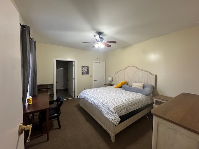 bedroom with ceiling fan and dark carpet