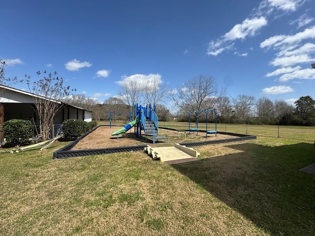 community play area with a lawn