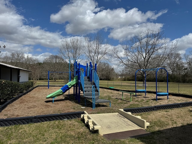 communal playground featuring a yard